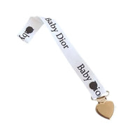 Attache tétine pour baby dior