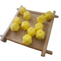 Perle hexagonal 14 mm jaune pour attache tétine