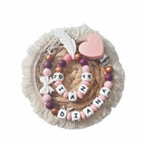 ensemble d'anneau de dentition avec son anneau dentition assortie de couleur prune et cuivré 