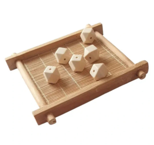 perle hexagonal en silicone alimentaire beige pour confection attache tétine grossiste 