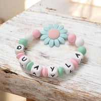 annneau de dentition en silicone personnalisé au motif marguerite