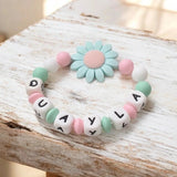 annneau de dentition en silicone personnalisé au motif marguerite