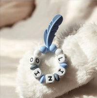 anneau de dentition pour bébé motif plume