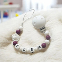 attache tétine prune en silicone mam