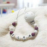attache tétine prune en silicone mam