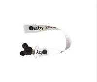 attache tétine blanche baby dior en ruban