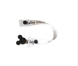 attache tétine blanche baby dior en ruban