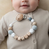 attache tetine en bois et silicone bleu