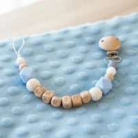 attache tétine en silicone et bois de couleur bleue et blanc 