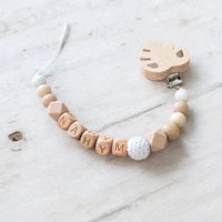 Attache tetine silicone et bois theme feuille, accessoire bebe naturel, longueur 22 cm sans le clip et la tetine.