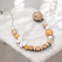 Attache tétine artisanale en silicone blanc et perles dorées avec adaptateur pour tétine Mam et clip de fixation.