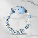 cette attache tetine clip mam de couleur blanc et bleu
