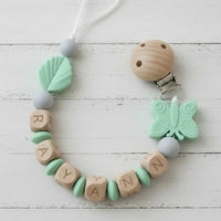 attache tetine clip de couleur menthe motif papillon 