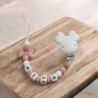 attache tétine bébé motif disney minnie de couleur blanche 