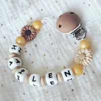 attache tetine mam clip marron et beige poser à plat 