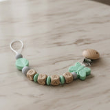 attache tetine mam clip silicone papillon menthe