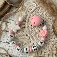 attache tetine mam clip marguerite rose et papillon blanc 