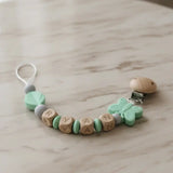 attache tetine mam clip silicone papillon menthe