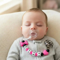 attache tetine mam accrocher sur un bebe 