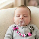 attache tetine mam accrocher sur un bebe 