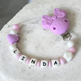 ttache tétine personnalisée en silicone Lila avec clip Minnie rose, perle en forme de cœur et adaptateur pour sucette MAM.