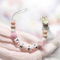 attache tétine personnalisé en silicone de couleur rose
