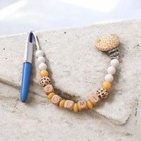 attache tétine stylo pour les grand motif léopard