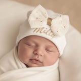 bonnet bébé fille noeud crème paillette porter par un bébé