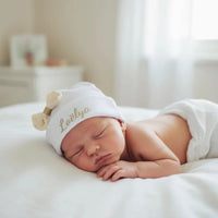 ce bonnet bébé naissance blanc pour bébé en coton avec noeud crème paillette 