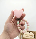 clip coeur silicone rose pale attache tetine 