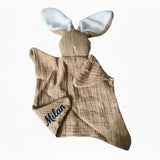 doudou plat forme lapin de couleur marron 