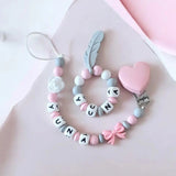 modèle pour fille attache tétine et anneau de dentition assortis