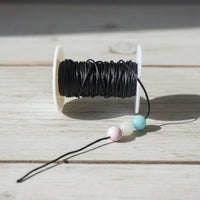 fil satin nylon en polyester de couleur noir pour attache tetine anneau de dentition