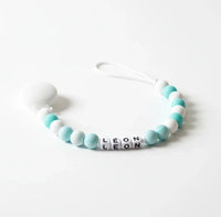 modèle de création avec la perle  ronde en silicone 12mm turquoise marbré