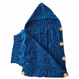 nid ange tricot en laine marine ouvert intérieur 