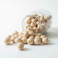 perle en bois ronde avec étoile gravé