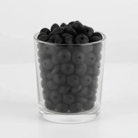 perle en silicone de couleur noir  sous forme plate lentille pour création attache tétine 