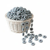cette perle en silicone de forme marguerite de couleur gris clair pour création attache tetine et anneau dentition