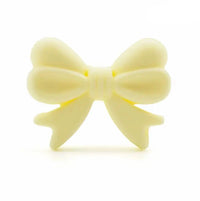 perle noeud en silicone jaune-clair pour confection attache tetine et anneau dentition