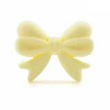 perle noeud en silicone jaune-clair pour confection attache tetine et anneau dentition