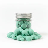 perle en silicone en forme tete mickey en couleur menthe